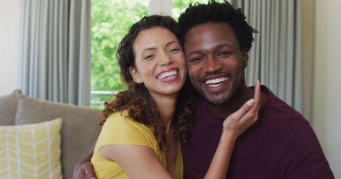 Joyful Biracial Couple Embracing in Living Room - Download Free Stock Images Pikwizard.com
