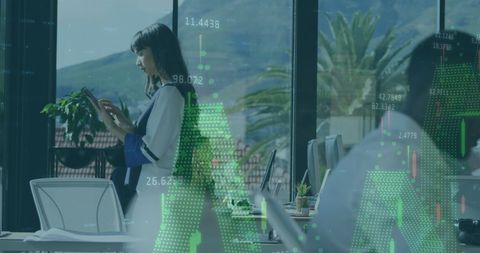 Businesswoman Analyzing Financial Data on Digital Tablet in Office