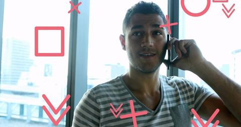 Man Engaged on Smartphone with Urban Skyline Background