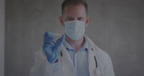 Doctor Holding Test Tube in Clinical Lab with Mask and Stethoscope