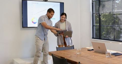 Diverse Professionals Collaborating in Modern Office Meeting Room