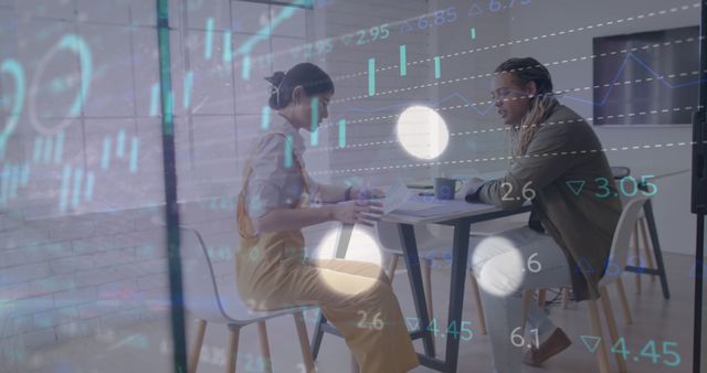 Two Professionals Discussing Finances in Modern Business Setting with Financial Data Overlay - Download Free Stock Images Pikwizard.com