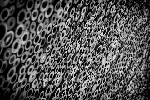 Artistic wall of bundled bamboo in black and white