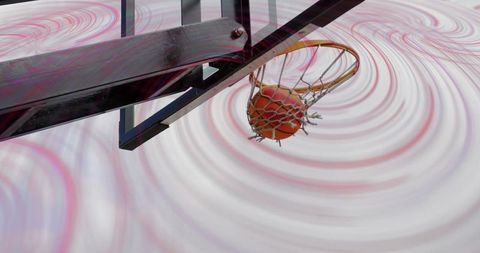 Dynamic basketball shot with abstract spiral background