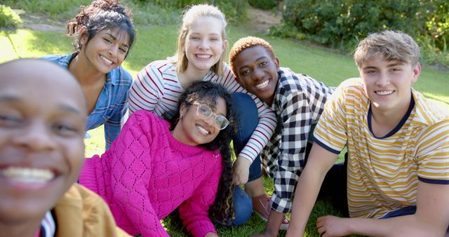 Diverse Group of Friends Smiling and Relaxing on Grass - Download Free Stock Images Pikwizard.com