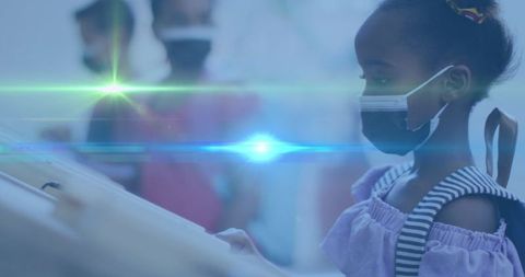 Young Student Wearing Mask Attentive in Classroom