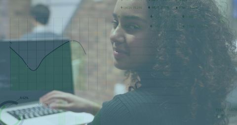 Biracial businesswoman analyzing stock market data on laptop