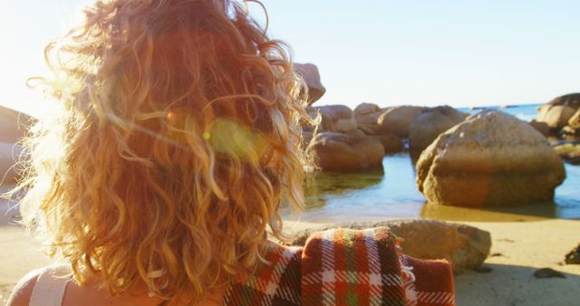 Person with Curly Hair Admiring Beach at Sunset - Download Free Stock Images Pikwizard.com