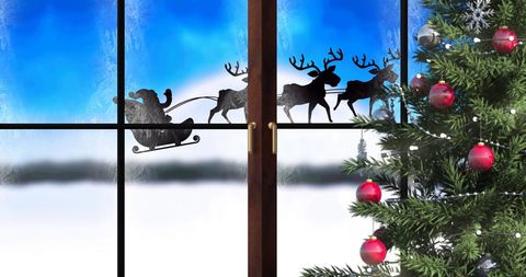 Santa Claus Silhouette in Sleigh with Reindeer by Christmas Tree