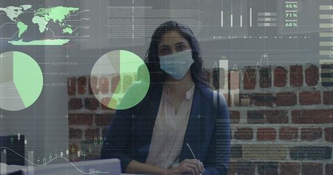 Businesswoman analyzing financial data under covid-19 restrictions