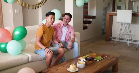 Joyful Birthday Celebration with Balloon Decor and Party Foods