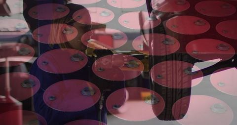 Female mechanic working with automotive tools and storage background