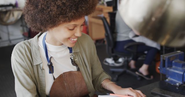 Young African American Woman Smiling in Workshop - Download Free Stock Images Pikwizard.com