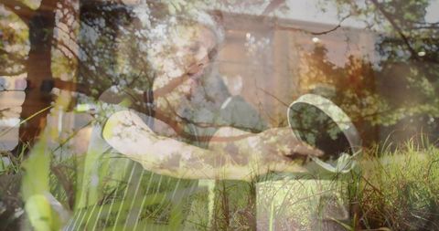 Woman gardening with metal watering can outdoors