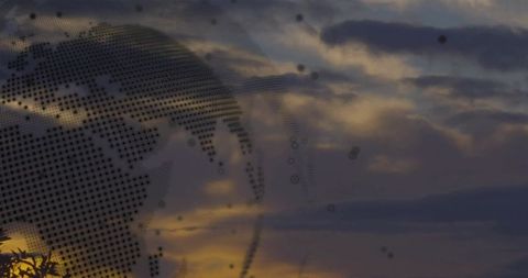 Digital Globe Overlay on Sunset Sky Scenic Background