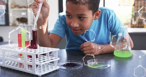 Curious boy conducting science experiment with chemicals