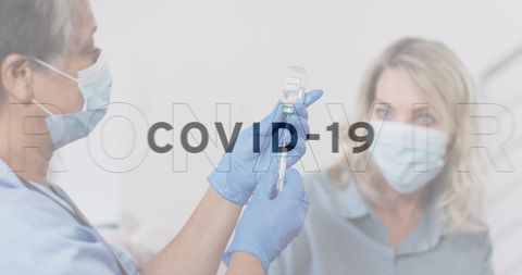 Healthcare worker administering covid-19 vaccine to patient