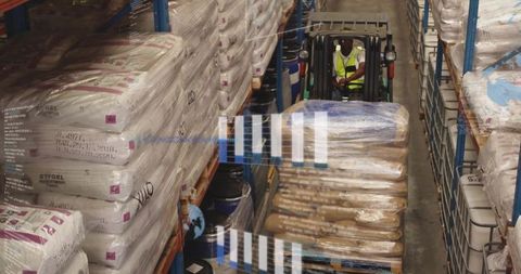 Forklift Operator Managing Warehouse Inventory in Industrial Setting