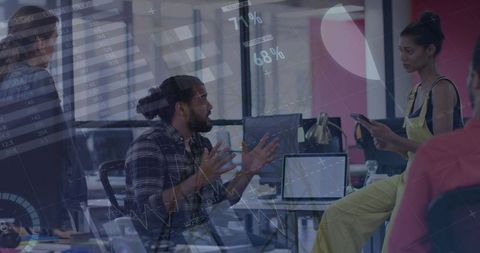 Diverse team collaborative planning with business analytics display