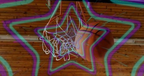 Basketball shot through hoop with neon star overlay
