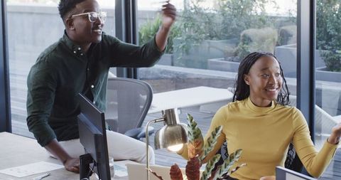 Diverse team engaged in creative brainstorming session at office