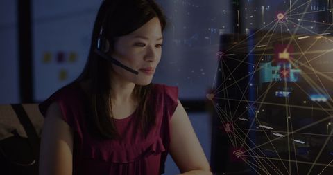 Asian Businesswoman Engaging with Digital Interface in Modern Office