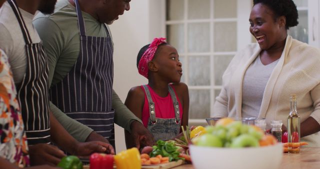 Family Preparing Meal in Kitchen, Smiling and Laughing Together - Download Free Stock Images Pikwizard.com