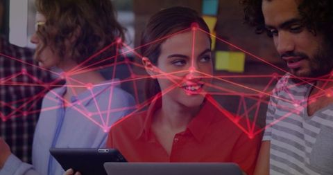 Smiling woman leading creative coworking team with tablet, laptop and network overlay