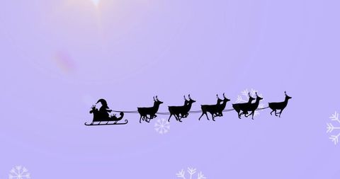 Silhouette of Santa with Sleigh and Reindeer in Purple Sky