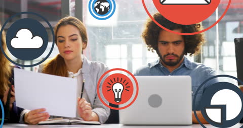 Focused Team Analyzing Reports with Modern Technology Icons