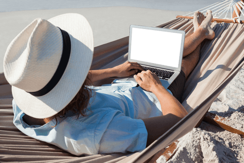 Man Relaxing on Beach Hammock Using Transparent Screen Laptop - Download Free Stock Videos Pikwizard.com