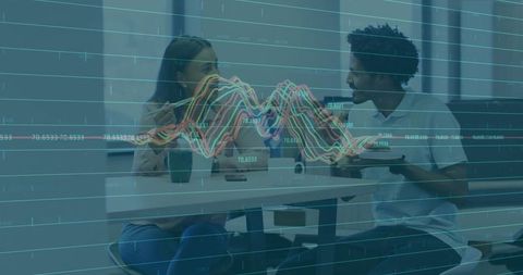 Colleagues discussing data over lunch in office break room