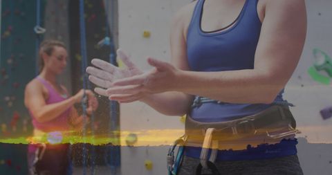 Women Rock Climbing Indoors Amid Sunset Landscape Overlay