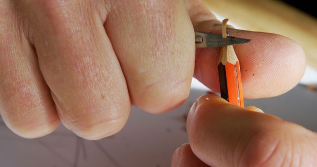 Close-up of Hand Sharpening Pencil with Small Knife - Download Free Stock Images Pikwizard.com