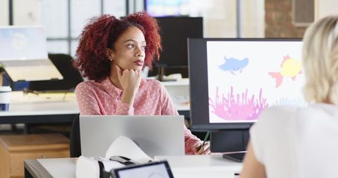 Professional Businesswoman Strategizing in Modern Office