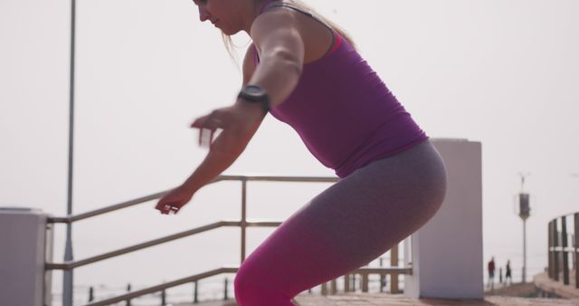 Woman Exercising Outdoors - In the Middle of a Squat - Download Free Stock Images Pikwizard.com