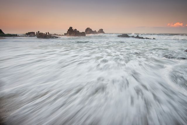 Seascape at Sunset with Waves Crashing on Rocky Shore - Download Free Stock Photos Pikwizard.com