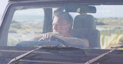 Mature Man Exploring Scenic Landscape from SUV by the Coast