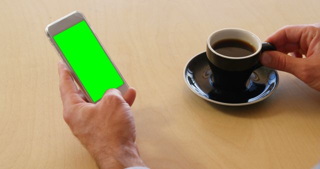 Person Using Smartphone with Green Screen Drinking Coffee - Download Free Stock Images Pikwizard.com