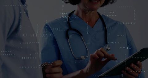 Nurse in Blue Scrubs Using Tablet with Binary Overlay