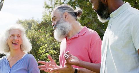 Senior Friends Sharing Laughter in Beautiful Park Setting