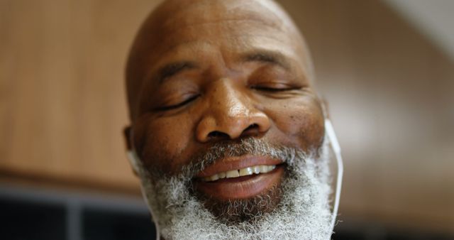 Smiling Elderly Man with Headphones Closing Eyes in Relaxation - Download Free Stock Images Pikwizard.com