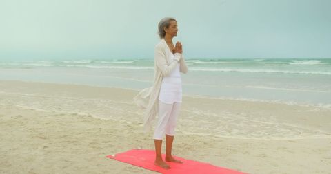 Elderly African American Woman Meditating During Yoga at Beach - Download Free Stock Images Pikwizard.com