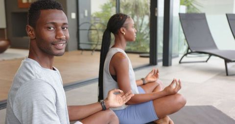Couple Practicing Mindfulness Meditation on Patio