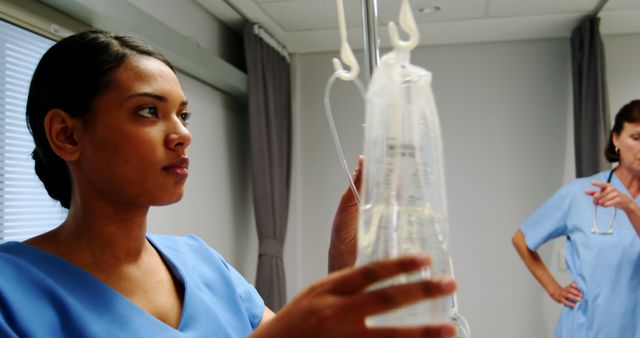 Nurse Adjusting IV Drip in Hospital Room - Download Free Stock Images Pikwizard.com