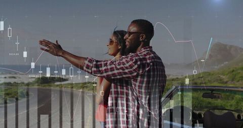 Couple pointing toward horizon on coastal road next to convertible, charts overlay