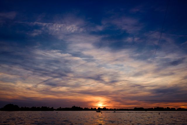 Beautiful Sunset Over Tranquil Lake with Soft Clouds - Download Free Stock Photos Pikwizard.com