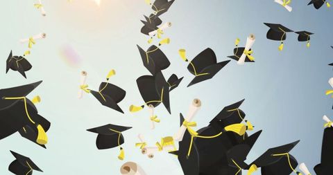 Graduation caps and diplomas floating in sky celebrating success