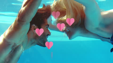 Joyful Couple Encountering Underwater Amidst Pink Hearts