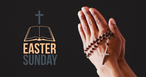 Easter sunday prayer hands with rosary on black background